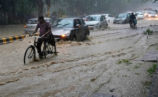 Delhi Roads Crumble Under Monsoon Deluge