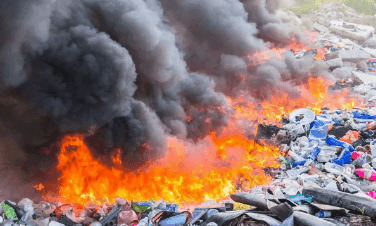 City Choked by Smoke from Trash Fires